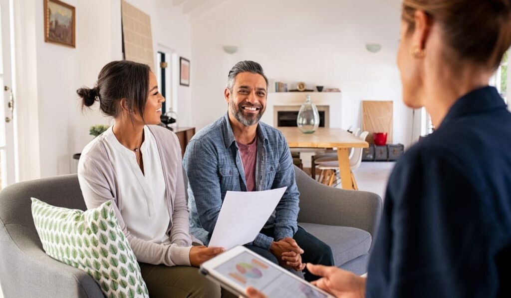 Homeowners consulting with a Realtor in Maryland about buying or selling property