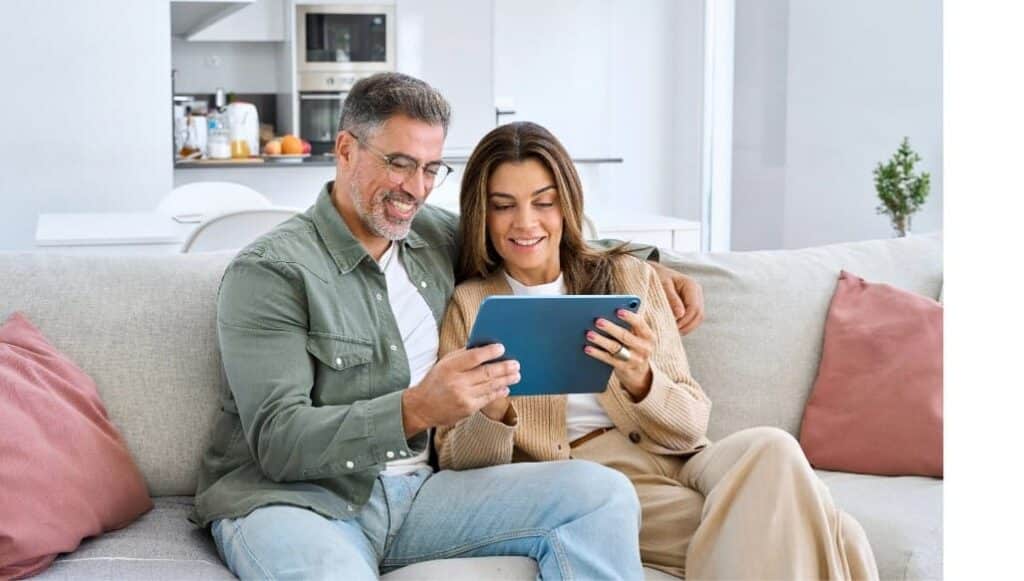 Sellers reviewing home listing details with Maryland Realtor Greg Leverton